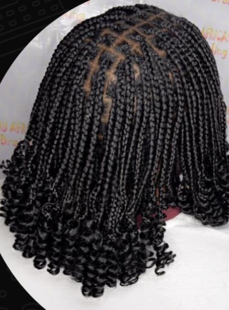 Long honey-blonde box braids with warm highlights