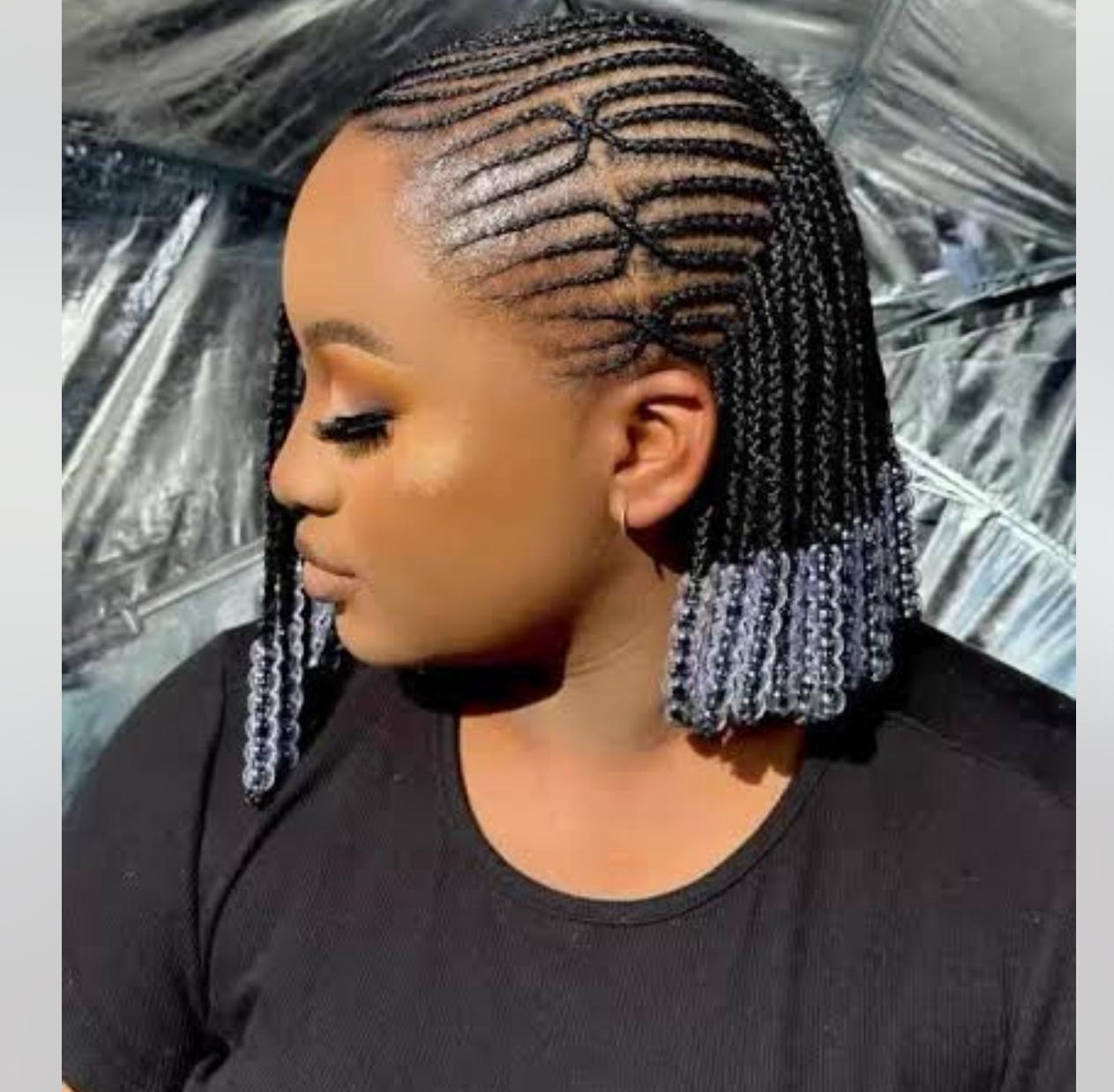 Side view of long braids styled close to the head